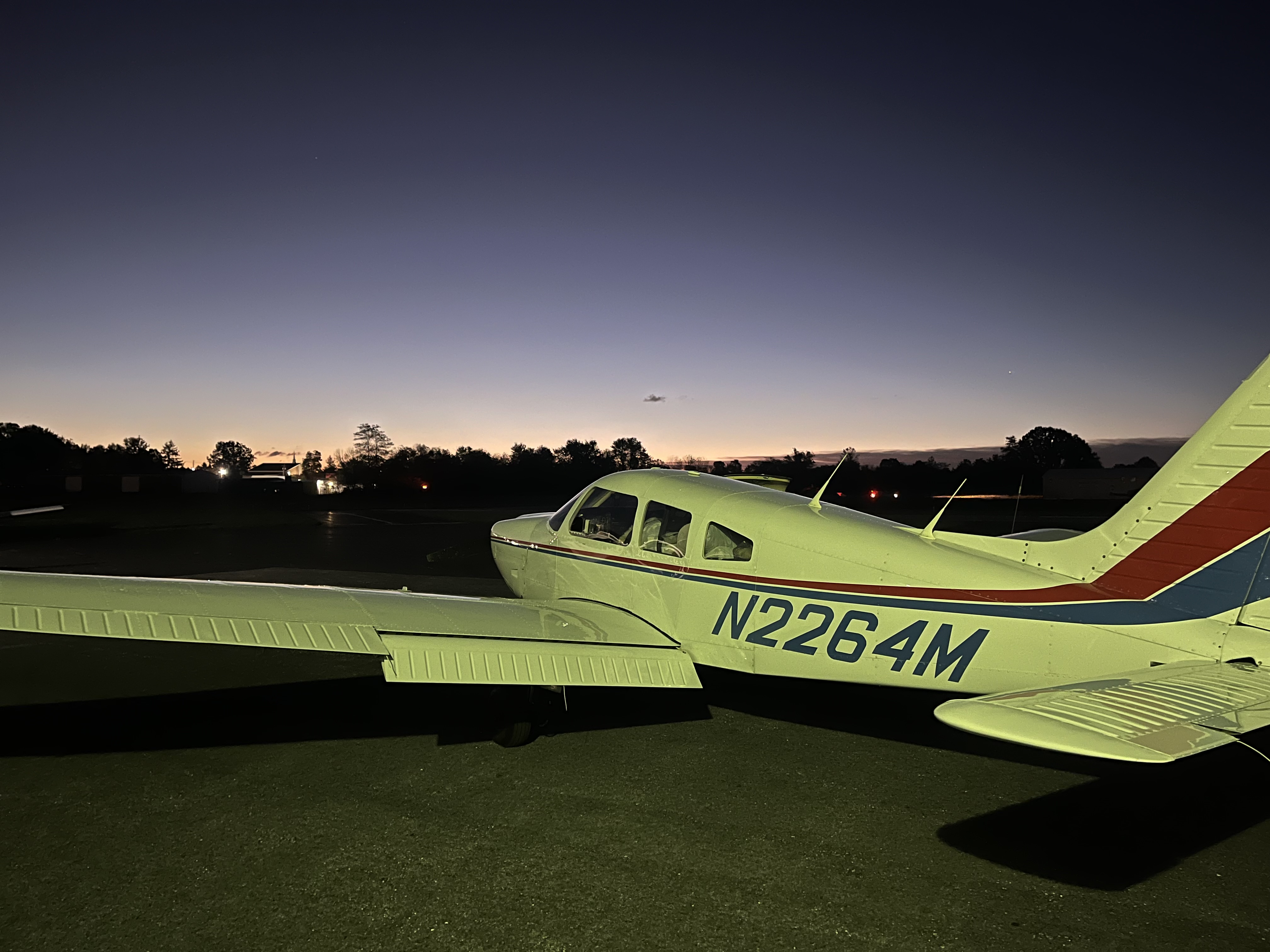 Students sitting in the Piper Archer cockpit at Gettysburg Flight School